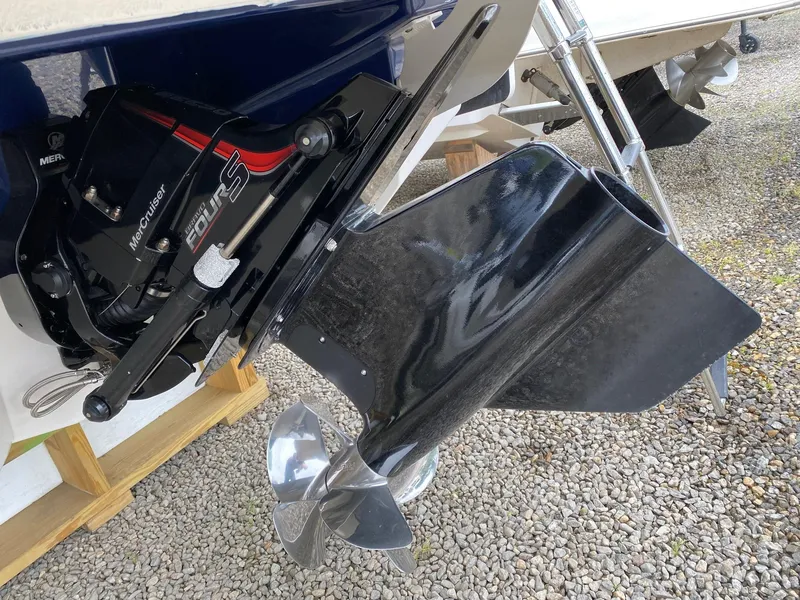 Slide: The Image of 2022 Chaparral 23 SSi boat with MerCruiser engine and propeller. - 25