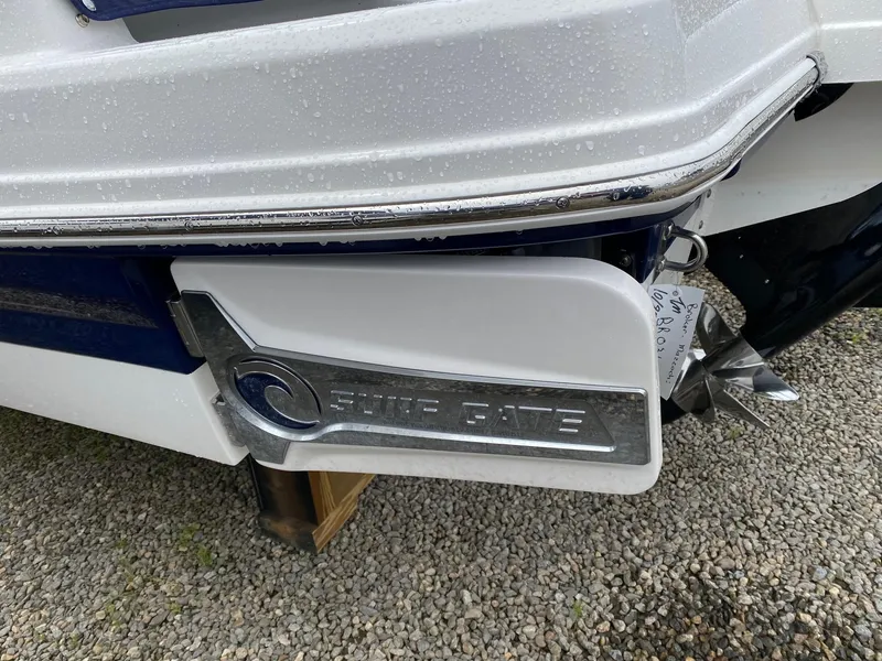 Slide: The Image of Close-up of 2022 Chaparral 23 SSi boat's stern with Surf Gate feature. - 26