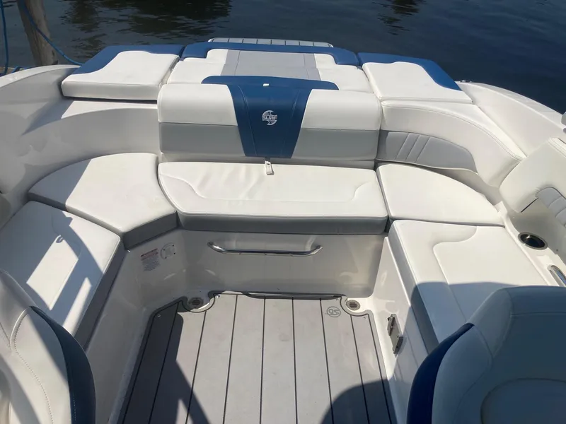 Slide: The Image of 2022 Chaparral 23 SSi boat interior with white and blue seating. - 5
