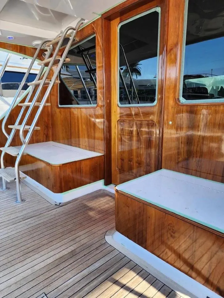 Slide: The Image of 2012 Custom Carolina Ritchie Howell 60 Sportfish boat with wooden deck and cabin. - 12