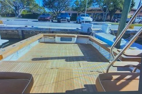 Slide: The Image of 2012 Custom Carolina Ritchie Howell 60 Sportfish boat deck at dock. - 14