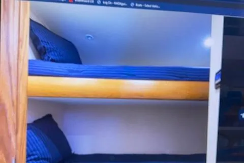 Slide: The Image of Bunk beds in the 2012 Custom Carolina Ritchie Howell 60 Sportfish yacht cabin. - 19