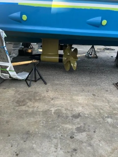 Slide: The Image of 2012 Custom Carolina Ritchie Howell 60 Sportfish boat propeller and hull during maintenance. - 21