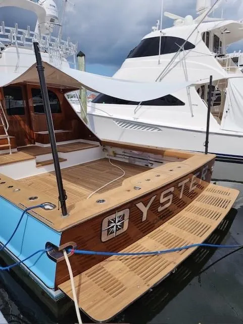 Slide: The Image of Custom Carolina Ritchie Howell 60 Sportfish 2012 yacht docked at marina. - 22