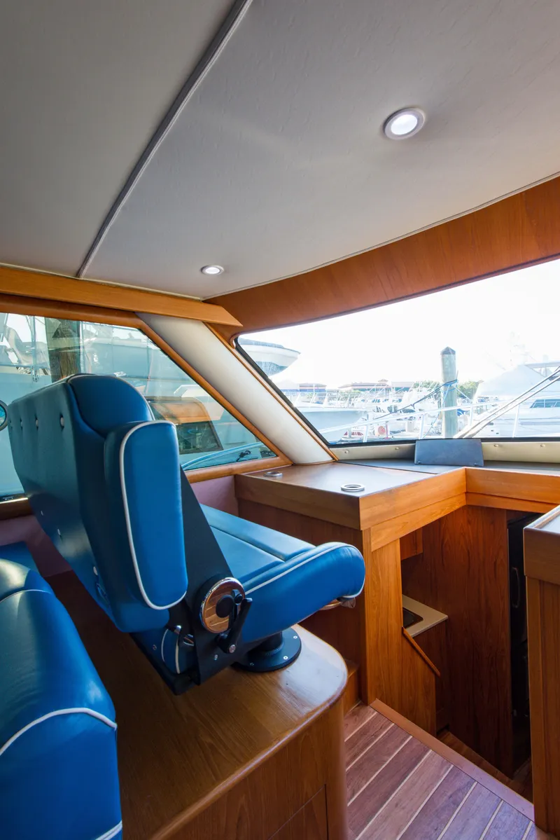 Slide: The Image of Interior of 2012 Custom Carolina Ritchie Howell 60 Sportfish yacht with blue seating. - 26