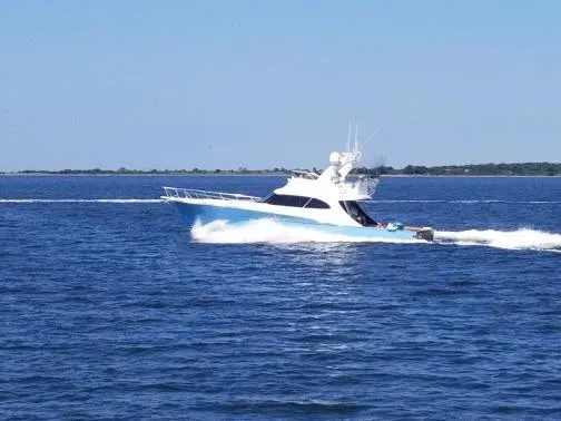 Slide: The Image of 2012 Custom Carolina Ritchie Howell 60 Sportfish cruising on open water. - 3