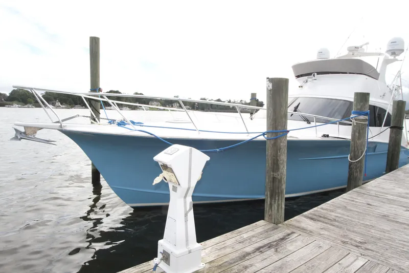 Slide: The Image of 2012 Custom Carolina Ritchie Howell 60 Sportfish docked at marina. - 33