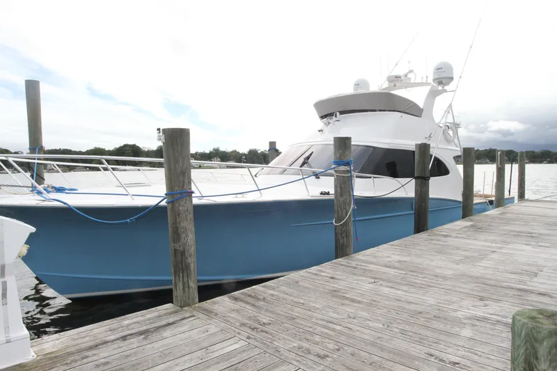 Slide: The Image of 2012 Custom Carolina Ritchie Howell 60 Sportfish yacht docked at a marina. - 35