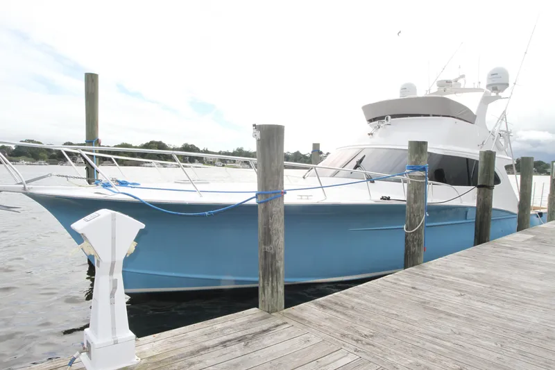 Slide: The Image of 2012 Custom Carolina Ritchie Howell 60 Sportfish yacht docked at marina. - 36