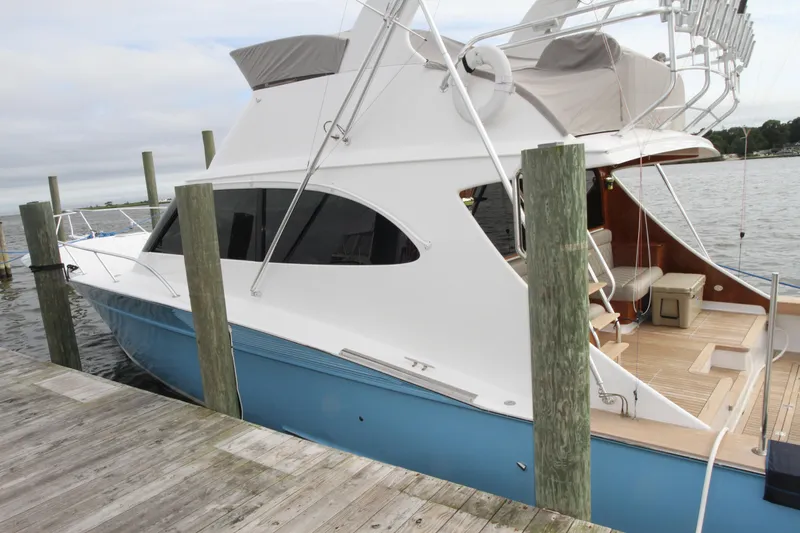 Slide: The Image of 2012 Custom Carolina Ritchie Howell 60 Sportfish docked, side view. - 37