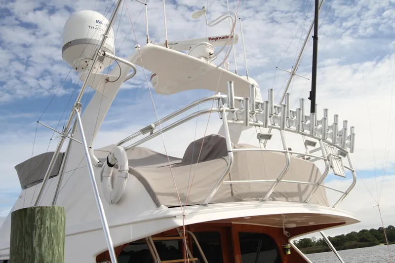 Slide: The Image of Custom Carolina Ritchie Howell 60 Sportfish 2012 boat with radar and rod holders. - 38