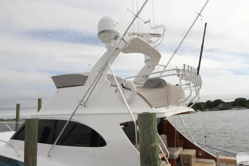 Slide: The Image of 2012 Custom Carolina Ritchie Howell 60 Sportfish yacht docked by the water. - 39