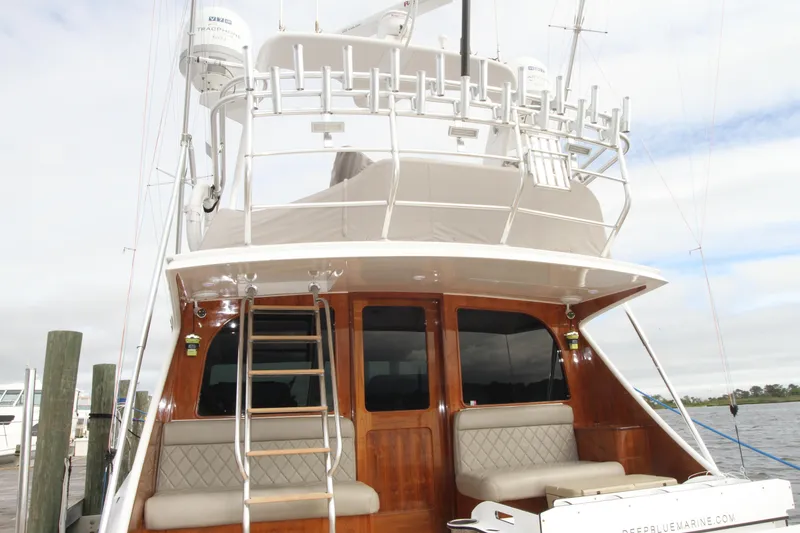 Slide: The Image of 2012 Custom Carolina Ritchie Howell 60 Sportfish yacht, rear view with seating and ladder. - 46