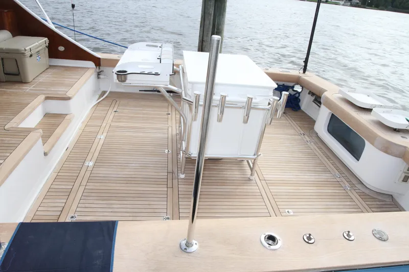 Slide: The Image of Custom Carolina Ritchie Howell 60 Sportfish 2012 boat deck with fishing rod holders. - 47