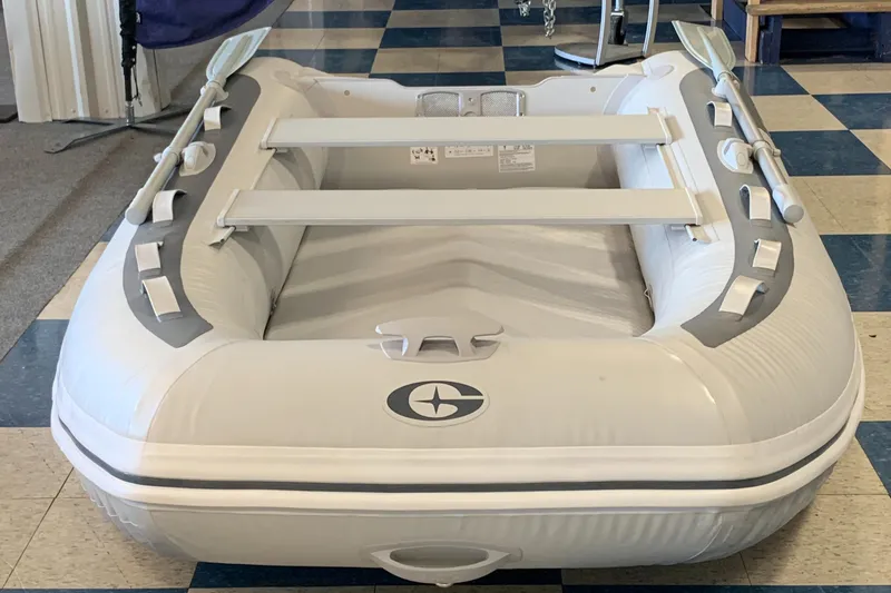 Slide: The Image of 2023 Gala F270 inflatable boat on checkered floor. - 2