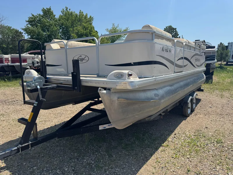 Slide: The Image of 2004 Godfrey SweetWater 2019SC pontoon boat on trailer, parked outdoors. - 1