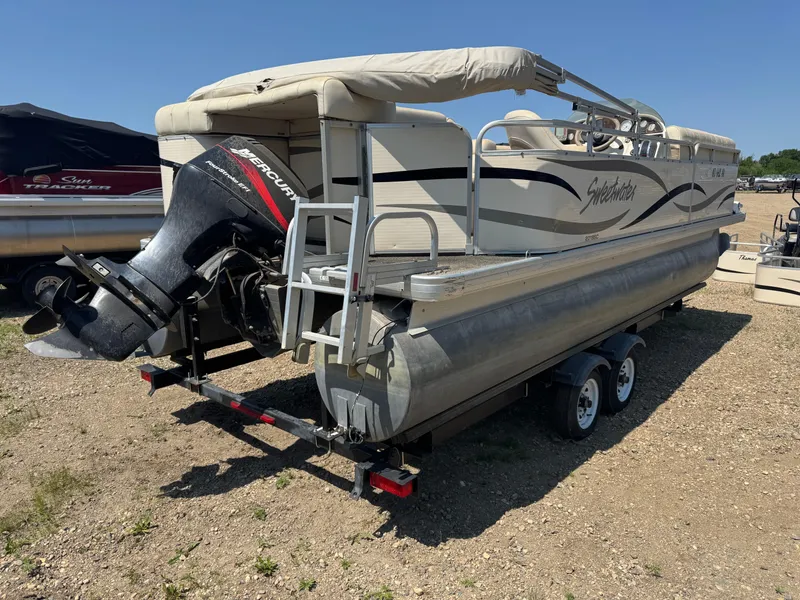 Slide: The Image of 2004 Godfrey SweetWater 2019SC pontoon boat with Mercury outboard motor on trailer. - 3