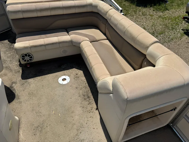 Slide: The Image of Beige seating area on a 2004 Godfrey SweetWater 2019SC boat. - 7