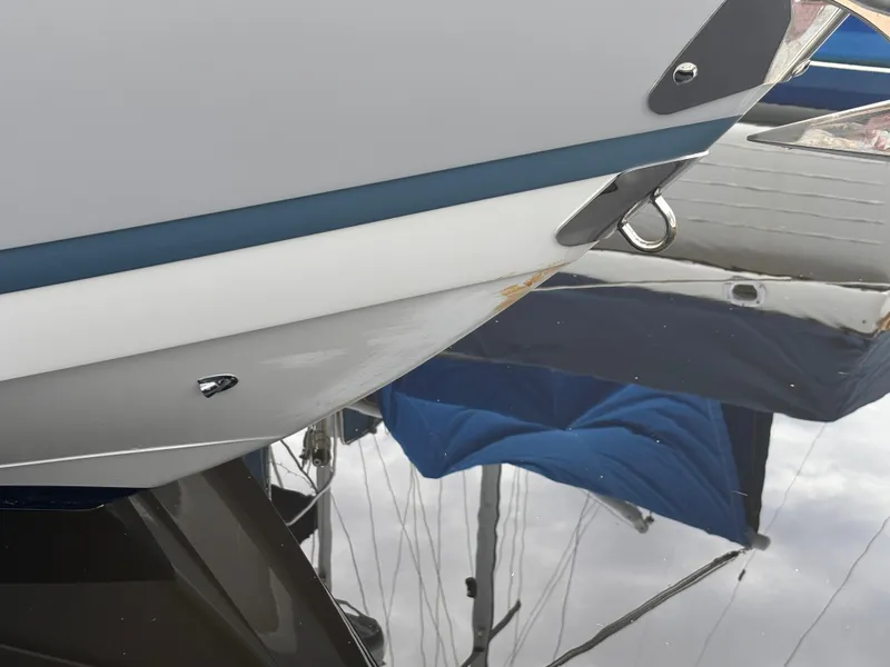 Slide: The Image of Close-up of 2022 Cobalt 30SC boat hull with water reflection. - 14