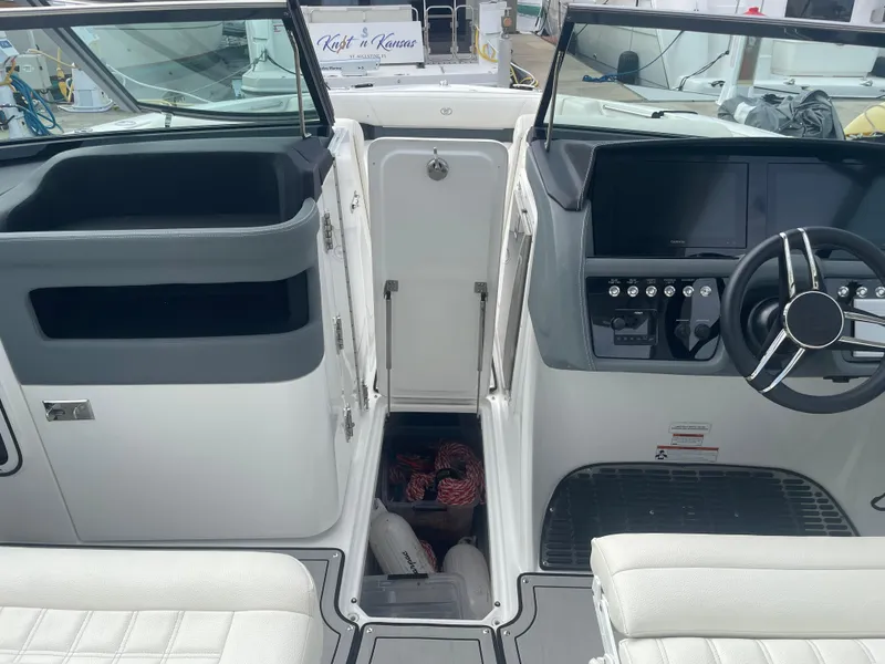 Slide: The Image of 2022 Cobalt 30SC boat interior with steering wheel and dashboard. - 19