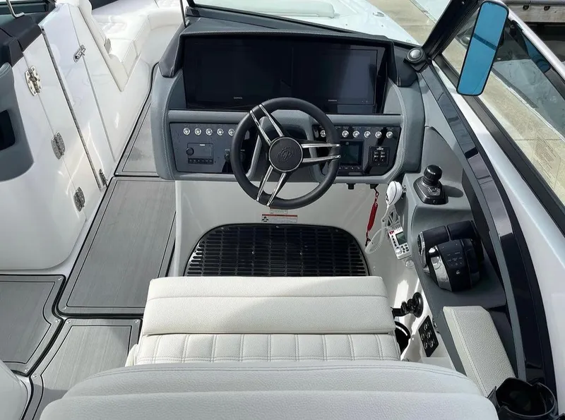 Slide: The Image of 2022 Cobalt 30SC boat cockpit with modern controls and dual screens. - 20
