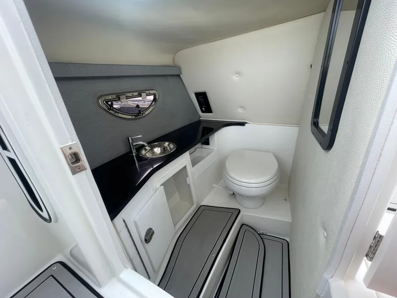 Slide: The Image of 2022 Cobalt 30SC boat interior bathroom with sink and toilet. - 25