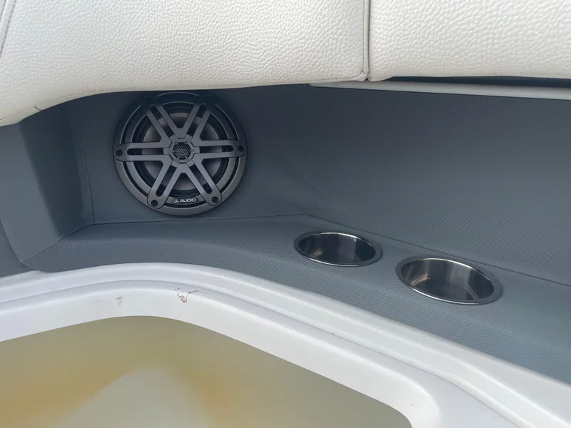 Slide: The Image of 2022 Cobalt 30SC boat interior with speaker and cup holders. - 35