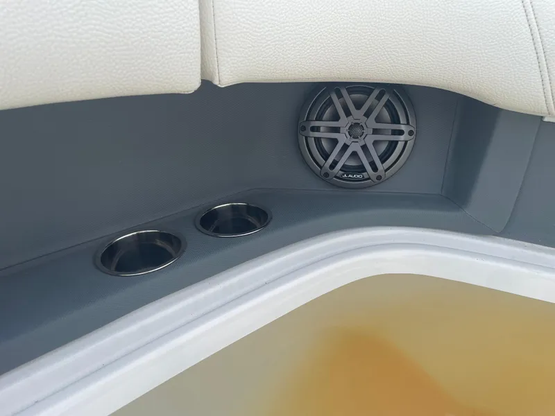 Slide: The Image of Cobalt 30SC 2022 boat interior with speaker and cup holders. - 36