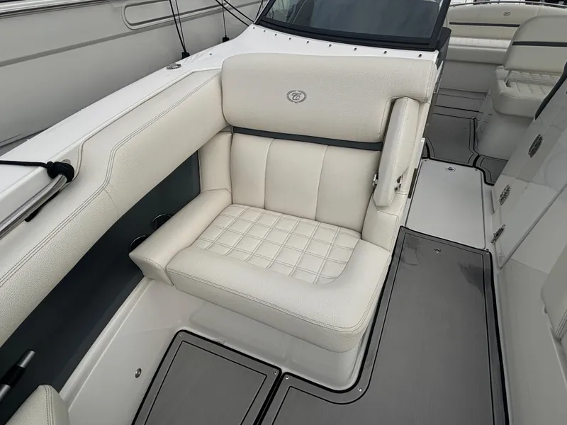 Slide: The Image of 2022 Cobalt 30SC boat interior with luxurious white seating. - 37