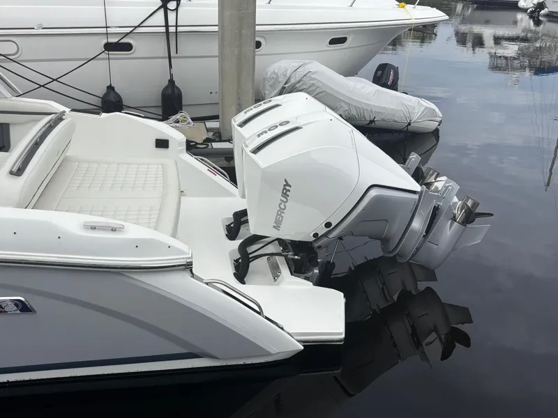 Slide: The Image of 2022 Cobalt 30SC boat with Mercury outboard engine docked at marina. - 4