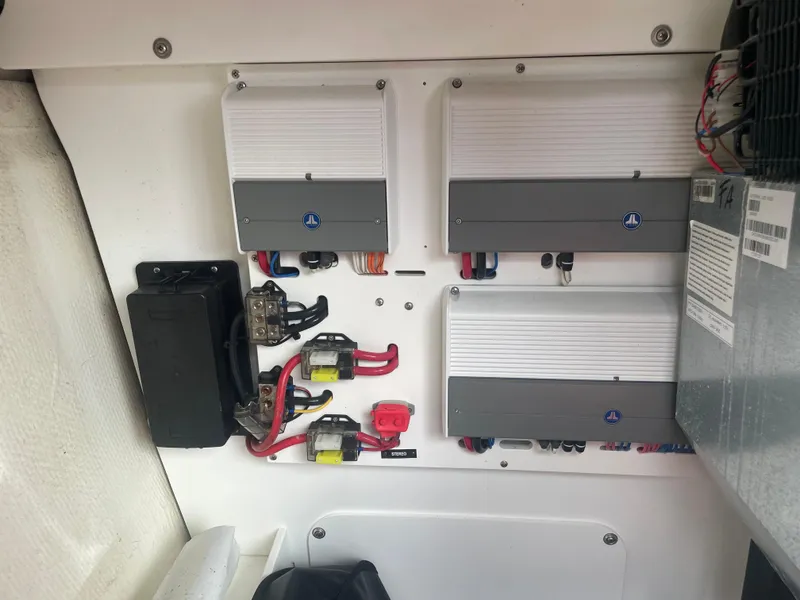 Slide: The Image of Electrical panel of a 2022 Cobalt 30SC boat with wiring and components. - 40