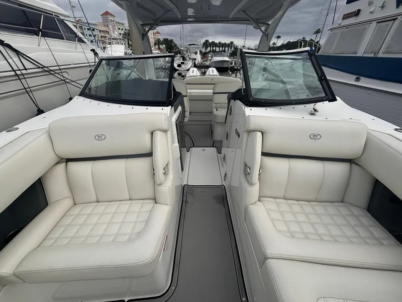Slide: The Image of 2022 Cobalt 30SC boat interior with white leather seating and modern design. - 43