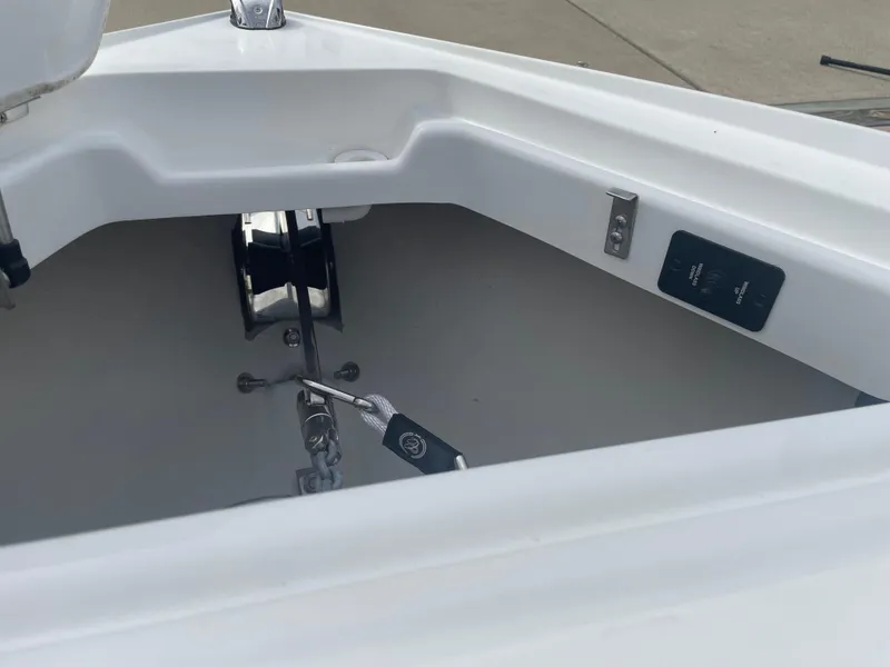 Slide: The Image of 2022 Cobalt 30SC boat anchor compartment with winch and controls. - 46