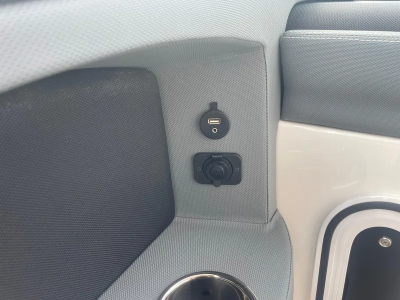 Slide: The Image of 2022 Cobalt 30SC interior with USB port and cup holder. - 47