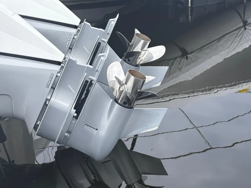 Slide: The Image of 2022 Cobalt 30SC boat propellers reflecting on water surface. - 5