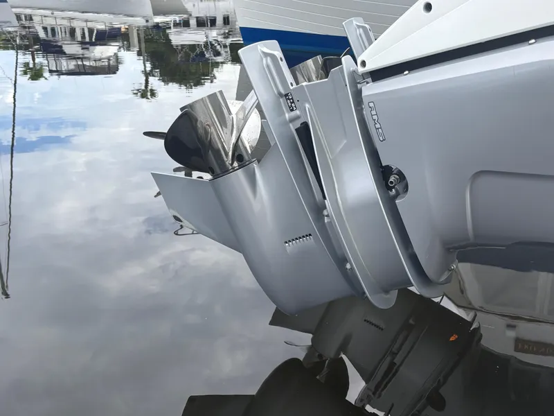 Slide: The Image of 2022 Cobalt 30SC boat engine reflecting on calm water surface. - 7