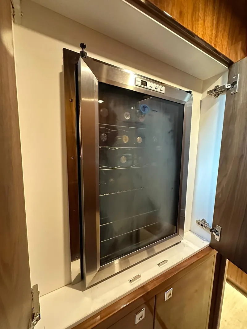 Slide: The Image of Built-in wine cooler in a Riviera 60SY 2018 yacht interior. - 10