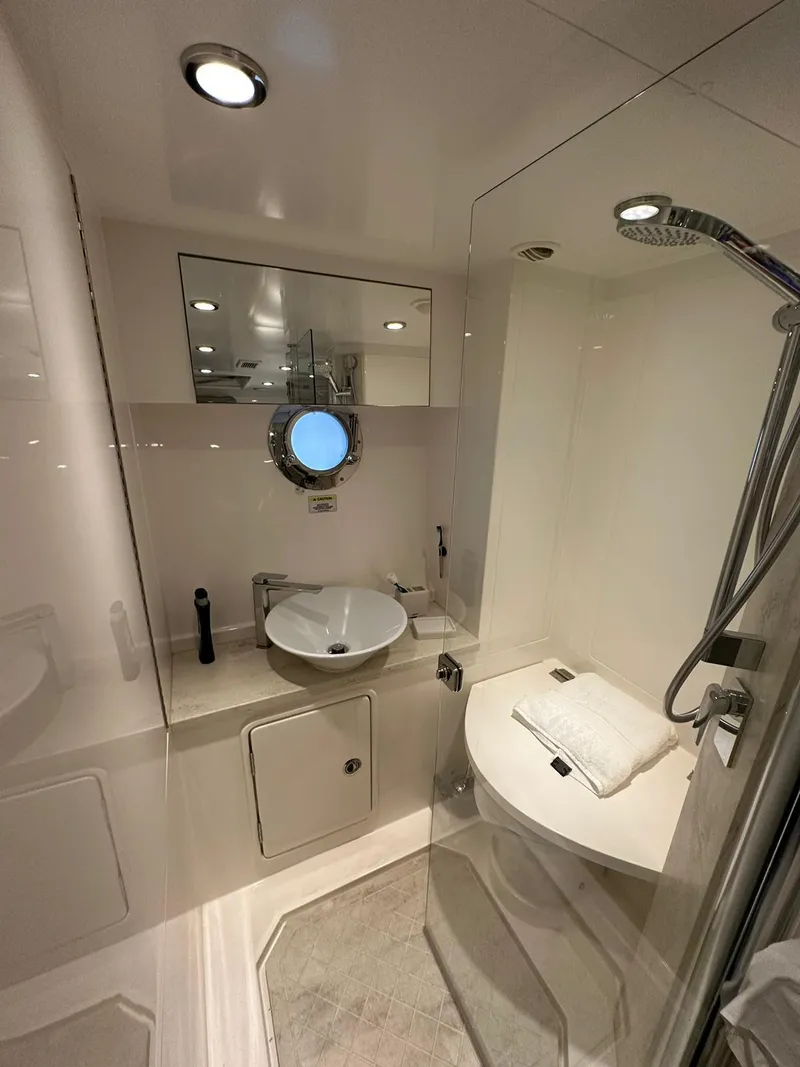 Slide: The Image of Luxurious bathroom in 2018 Riviera 60SY yacht with modern fixtures and elegant design. - 20