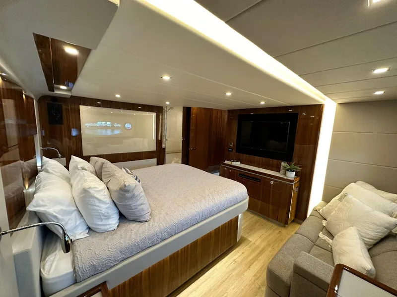 Slide: The Image of Luxurious bedroom interior of 2018 Riviera 60SY yacht with modern amenities and elegant design. - 24