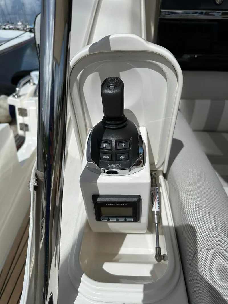 Slide: The Image of Control panel of a 2018 Riviera 60SY yacht, featuring joystick and display. - 26