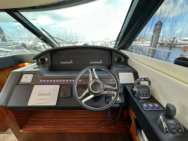 Slide: The Image of Helm of 2018 Riviera 60SY yacht with Garmin navigation system and modern controls. - 28