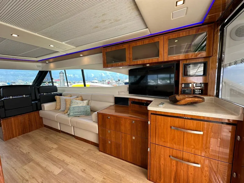 Slide: The Image of Luxurious interior of 2018 Riviera 60SY yacht with elegant wood finishes and modern amenities. - 8