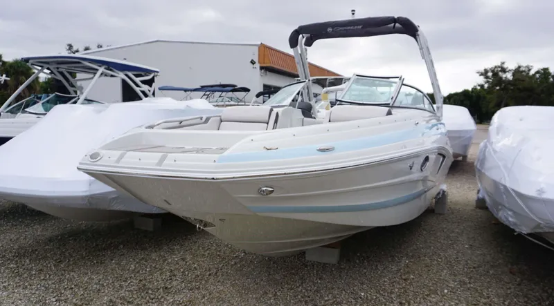 Slide: The Image of 2024 Crownline 260 XS boat displayed outdoors. - 1