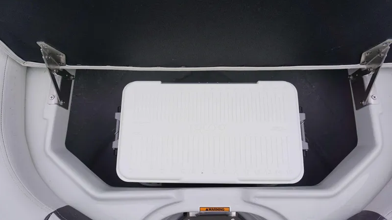 Slide: The Image of Storage compartment with Igloo cooler in 2024 Crownline 260 XS boat. - 11