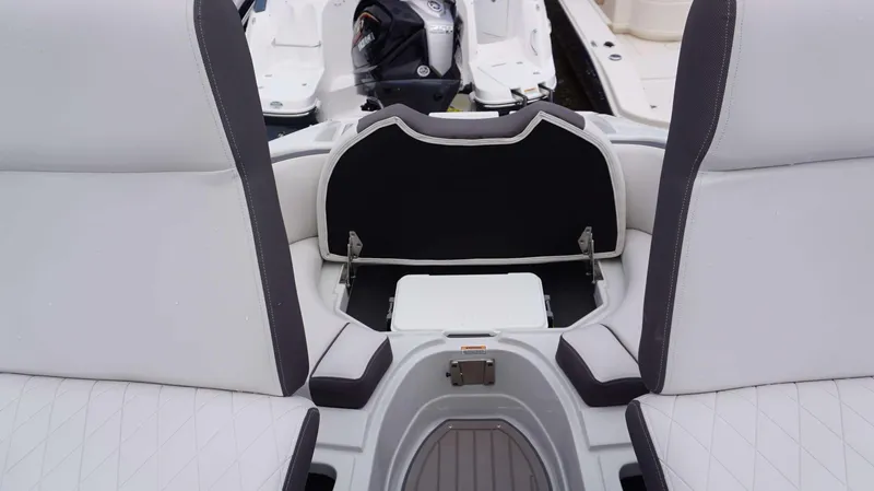 Slide: The Image of 2024 Crownline 260 XS boat seating area with storage compartment. - 12