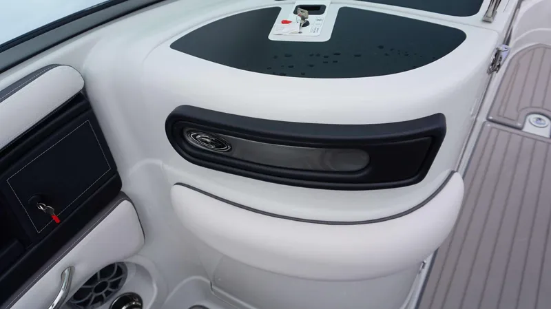 Slide: The Image of Interior detail of the 2024 Crownline 260 XS boat, featuring sleek design and modern controls. - 13