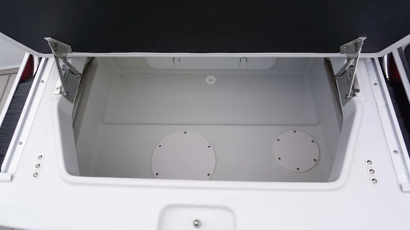 Slide: The Image of Open storage compartment of 2024 Crownline 260 XS boat. - 20