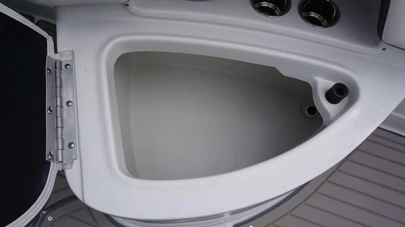 Slide: The Image of Open storage compartment on 2024 Crownline 260 XS boat. - 21