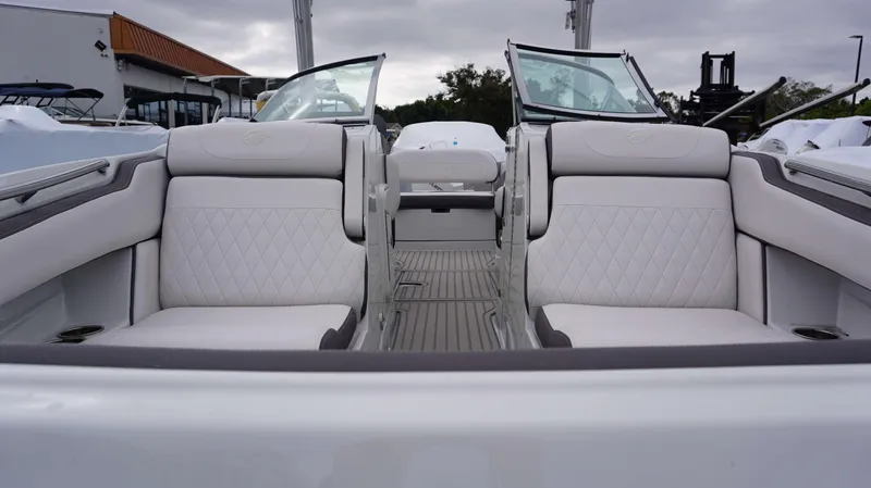 Slide: The Image of 2024 Crownline 260 XS boat interior with luxurious white seating and diamond stitching. - 23