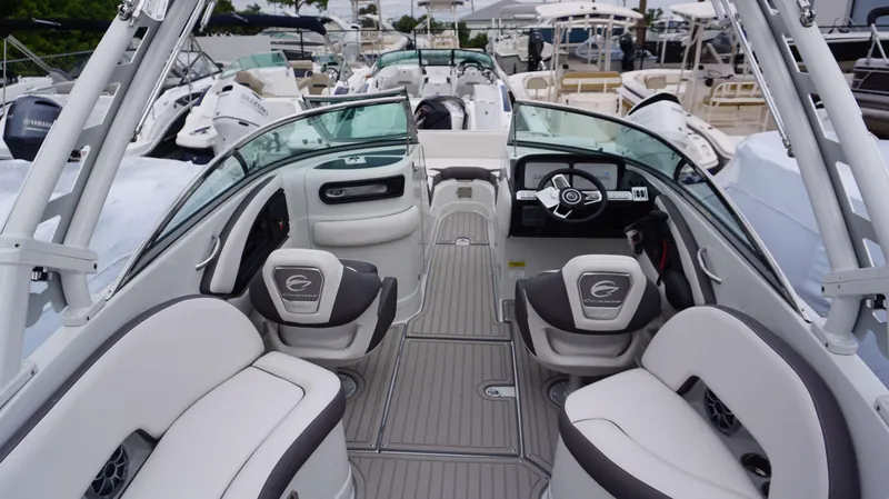 Slide: The Image of 2024 Crownline 260 XS boat interior with modern seating and steering wheel. - 24